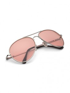  One pink color sunglasses placed on a white table