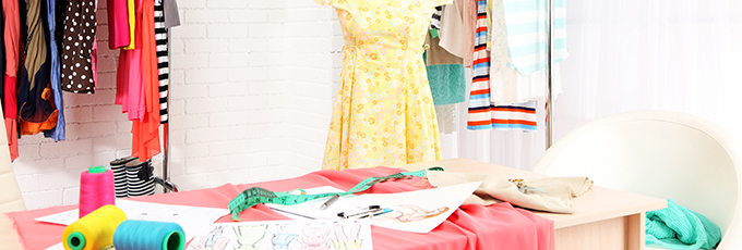  A table with fabrics and threads and designs