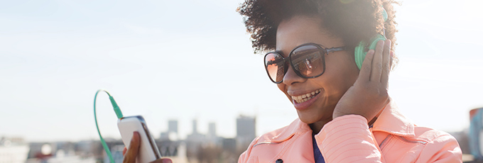  A woman with sunglasses and headphones